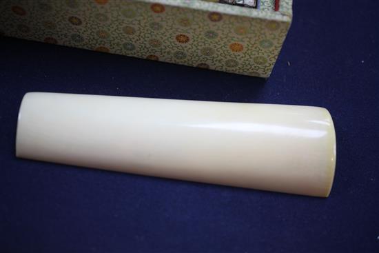 A pair of Chinese ivory wrist rests, early 20th century, 20.5cm, silk brocade covered stands